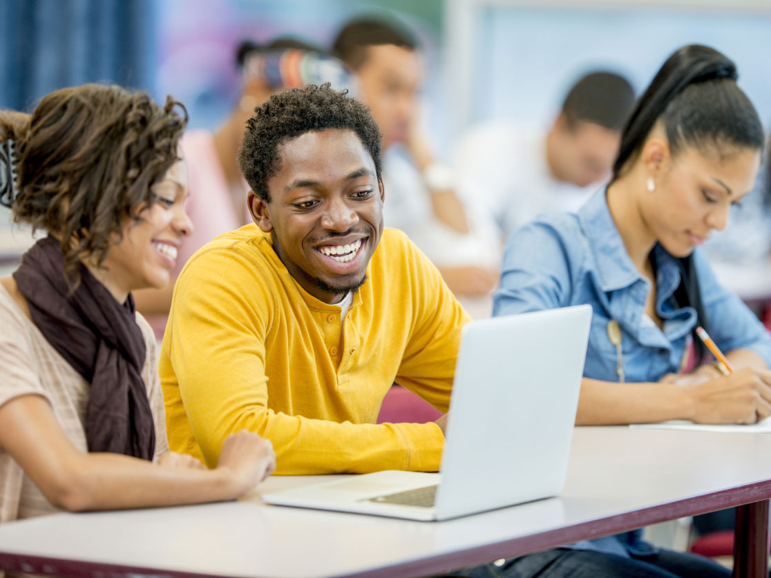 A quilt made of greens, blues, and beige patterned fabrics. It is made as a star quilt, with pieces depicting an eight-point star.
